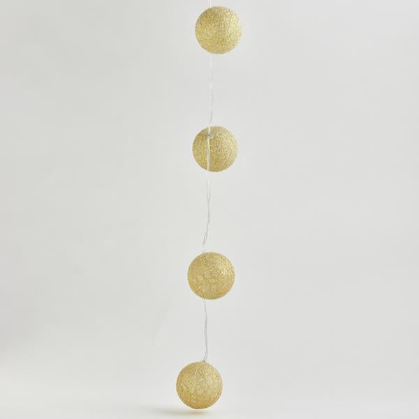 10 Led Σειρά 5mm, με Χρυσές Υφασμάτινες Μπάλες 6εκ., Μπαταρίας 2xΑΑ, Timer, Διάφανο PVC Καλώδιο, Θερμό Λευκό Led ανα 15εκ., Προέκταση Παροχής 30εκ., IP20